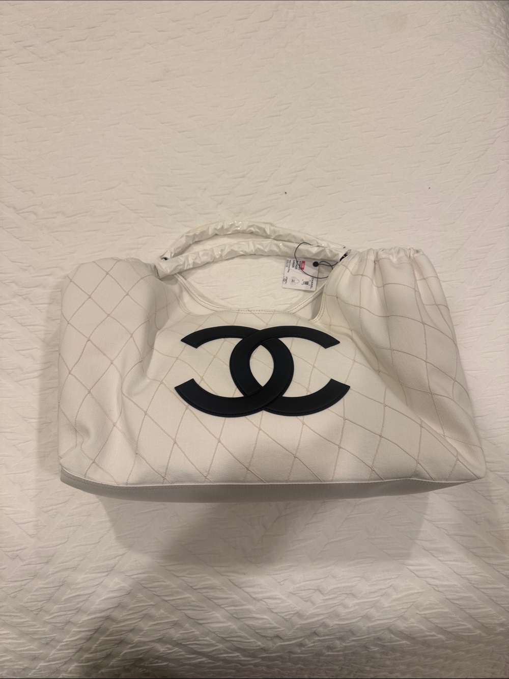 CHANEL White Quilted Shoulder Bag with Black CC Emblem